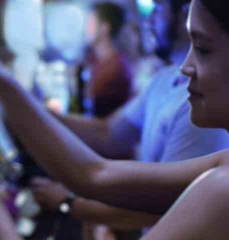 ramp certified bartender pouring draft beer from a tap behind the bar
